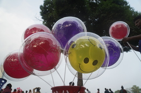 A vendor sells balloon on a holiday on a park in Dhaka.