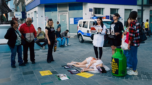 Vegan activists from Izmir protest with a special performance "The Big Animal Experiment Center" planned to be opened in Izmir Dokuz Eylul University. People passing by the crowded street followed them with interest.