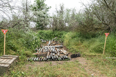 Unexploded munition collected by a de-mining unit of National Guards of Ukraine, before they will be destroyed, are seen in a field near Khersone. Members of the unit have painstakenly de-mined many fields within the liberated territories to make sure that people can live and work especially in the agriculture sector without fear of being killed or maimed by unexploded munition or landmines.