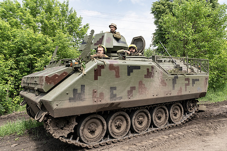 Members of mortar unit of 57th artillery brigade of Ukrainian Army Forces pose on YPR-765 Dutch made armored personnel vehicle in undisclosed location near Bahmut in Donetsk region of Ukraine