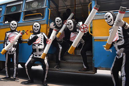 Volunteers wearing skeleton costume take part in an awareness rally against the use of tobacco on the occasion of "World No Tobacco Day" in Kolkata