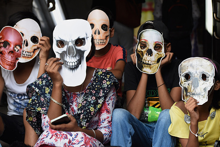Children wearing skeleton masks take part in an awareness rally against the use of tobacco on "World no Tobacco Day" in Kolkata.