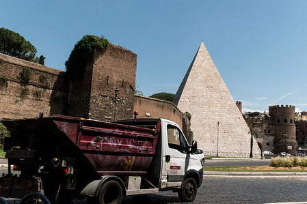 ROME, ITALY - MAY 31:Urban degradation of the Aurelian Wall of the Cestia Pyramid , invaded by weeds and dirt, in the historic centre of Rome  on May 31, 2023 in Rome, Italy.