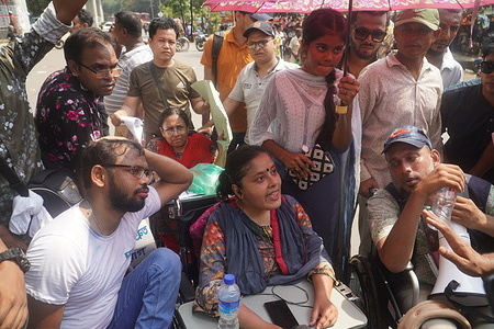 People with disabilities have held a sit-in program with 11-point demands including an increase in monthly allowance and assurance of getting the jobs according to their qualifications in front of the National Museum in Dhaka.
