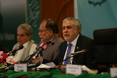Pakistani Finance Minister Ishaq Dar (R) addresses a press conference as he unveils the annual Economic Survey a day ahead of the fiscal year budget. Prime Minister Shehbaz Sharif's government is set to present the annual budget on Friday, at a time when the South Asian country faces its worst economic crisis with months of delay in securing funding from the International Monetary Fund (IMF). Pakistan's Planning Minister Ahsan Iqbal has said that Pakistan has approved an estimated 3.5% GDP growth target for its 2023-24 financial year budget.