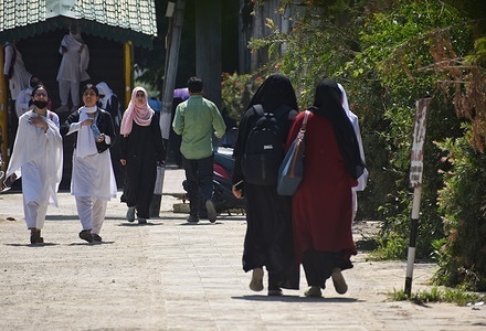 Kashmiri female students and Muslim women wearing 'Hijab' walk after attending their college in Srinagar, India on 08 June 2023.
Earlier the Girls protest against alleged abaya ban in school ,Principal clarified that the school will decide on abaya pattern for students.
Students at the Vishwa Bharti Higher Secondary School in Srinagar Kashmir have been barred from attending classes for wearing a Abaya inside the School School premises, while the The principal clarified that the ban was on colourful abayas, as it's against the college uniform rules. India has seen an increasing number of hate crimes and attacks against Muslims, Christians and Minorities in recent months.

Abaya is cloak or a loose outer garment worn by Muslim women. It has been part of Muslim women's attire for centuries. “We are protesting because the school is not allowing us to wear abayas,’’ a student said. “We were told we can wear abayas till the school entrance but not inside. There are many male students, so we cannot come to school without abaya,” she added.