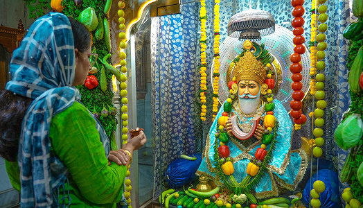 Sindhi woman worship to Lord Jhulelal decorated with 180 kg vegetables during forty-day-long Chaliho festival at Jhulelal temple in Beawar. Tomato, potato, capsicum, cauliflower, cabbage, bottle gourd, ridge gourd, brinjal, lemon, ladyfinger are used in the decoration of God.