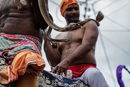 Snake charmers performing Jhapan rituals in rural Jharkhand during Mansa Puja in East Singhbhum district.