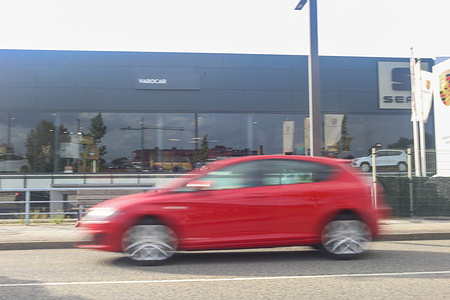 Lugones, Spain, 4th September, 2023: A Seat León passing in front of a Seat dealership during the disappearance of Seat as a brand, on September 4, 2023, in Lugones, Spain.