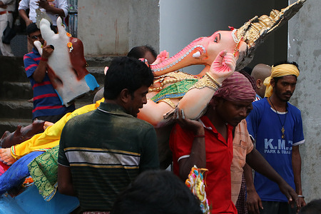 Devotees carry an idol of elephant-headed Hindu God Ganesha for immersion into the Ganges River during Ganesh Chaturthi festival in Kolkata, India, Wednesday, Sept. 20, 2023. The festival marks the birth of Lord Ganesha who is widely worshiped by Hindus as the god of wisdom, prosperity and good fortune.
