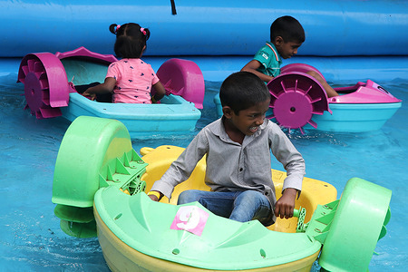Children participate in fun activities during an event held at the airport premises in Ratmalana. The event was organized to coincide with the World Children's Day.