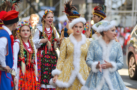 Members of the Polonaise Folk Dancers march along Fifth Avenue during the annual Pulaski Day Parade in New York City.