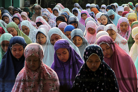 A number of students and teachers perform Istisqa prayers in congregation at Junior High School 17 in Jaticempaka, Pondok Gede, Bekasi City, Indonesia. The sunnah prayer was carried out as an effort to ask for immediate rain in the midst of the long dry season which is currently hitting a number of regions in Indonesia, including the city of Bekasi. The sunnah prayer was carried out as an effort to ask for immediate rain in the midst of the long dry season, which is currently hitting a number of regions in Indonesia, including the city of Bekasi.