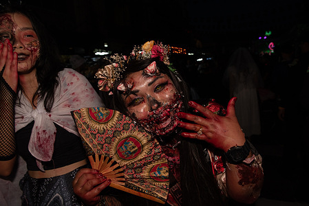 Tourists put on face makeup to attend "Khaosan Halloween 2023" in Bangkok, Thailand, on October 31, 2023. Beauty or Scary concept. to stimulate tourism business Expect to create a phenomenon for organizing Halloween events. To be number 1 in Asia.