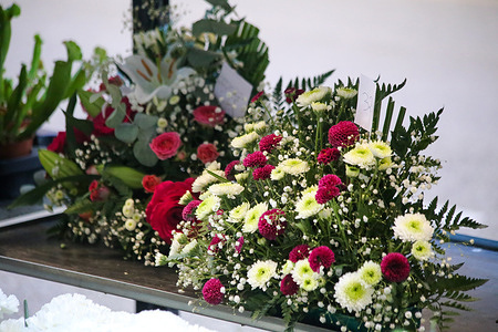Oviedo, Spain, October 31, 2023: A flower arrangement during Florists prepare for All Saints' Day, on October 31, 2023, in Oviedo, Spain.