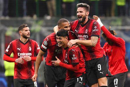 Olivier Giroud (AC Milan) and teammates celebrate the victory and greet the fans in the stands at the end of the soccer game AC Milan vs PSG - Champions League 2023/2024 Group F match day 4 at San Siro Stadium. AC Milan wins 2-1.