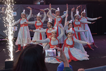 Indian people performing dance on the eve of their religious festival Diwali at dockland in Melbourne Australian.