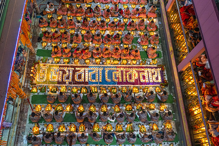 Every year thousands of Hindu devotees gather in front of Shri Shri Lokenath Brahmachari Ashram temple for the Kartik Brati or Rakher Upobash religious festival in Swamibagh, Dhaka, Bangladesh. Faithful sit in front of candles light ( named locally as Prodip ) and absorb in prayer.

Lokenath Brahmachari who is called Baba Lokenath was an 18th Century Hindu saint and philosopher in Bengal. Hindu worshipers fast and pray in earnest to the gods for their favors during the traditional ritual called Kartik Brati or Rakher Upobash.