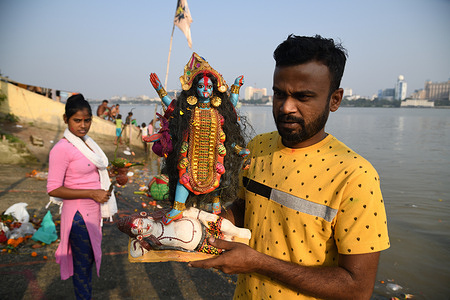 Kali idol immersion in the Ganges. The worship of Goddess Kali made by clay and decorated by other materials in autumn, is a single day annual Hindu religious festival. The Kali puja is believed to erase all negative energies and to welcome spiritual progress in Hinduism. It was celebrated on the 12th November, 2023 or the Dipannita Amavasya (new moon day) of the Hindu calendar 27th Kartika, 1430.