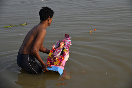 Lakshmi idol immersion in the Ganges. The worship of Goddess Lakshmi made by clay and decorated by other materials in autumn is a single day annual Hindu religious festival. The Lakshmi puja on Diwali celebration is considered the most important religious event, in which Hindus pray to Goddess Lakshmi, the provider of wealth and prosperity. It was celebrated on the 12th November, 2023 or the Dipannita Amavasya (new moon day) of the Hindu calendar 27th Kartika, 1430.