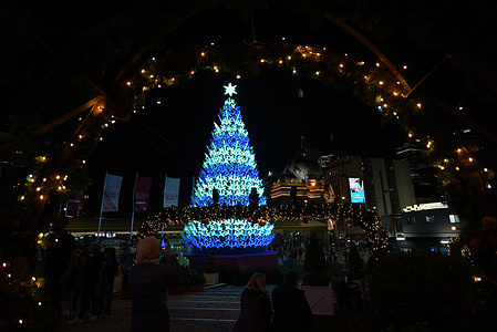 People keen interest in lighting in connection with the upcoming Christmas Celebration at Flinders Street in Melbourne.
