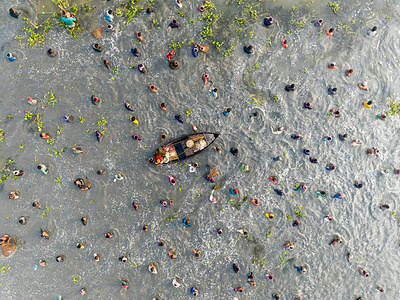 Polo fishing or group fishing is an amazing traditional festival in villagers in Bangladesh. People from several districts joined the area in a joyous mood. Usually, these open waterbodies preserve fishes all the year round. During the winter season, the water level in these vast water bodies drops and people jointly catches fishes with their locally-made nets, and other fishing gear. Most of the fishermen here catch fish and don't sell those. They eat those fishes with their family members as they are seasonal fishermen not professional ones. The fishing festival took place in Bhangura upazila of Pabna.