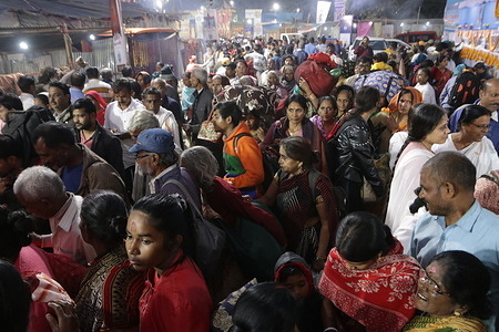 Hindu Devotees arrive ahead of the upcoming Hindu festival 'Gangasagar Mela', at a transit camp, in Kolkata on January 10, 2024.