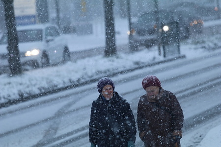 Two elderly women on their way to their destination during a heavy snowfall on Monday morning in Göttingen, Germany. In various parts of Germany, life has been affected due to heavy snowfall since early morning.