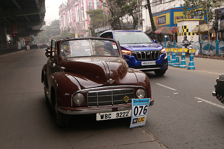 Car owner drives their vintage car on the road during Vintage Car show in Kolkata.