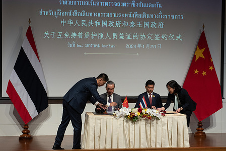 H.E. Mr. Parnpree Bahiddha-Nukara (2nd R), Deputy Prime Minister and Minister of Foreign Affairs of Thailand, and H.E. Mr. Wang Yi (2nd L), Member of the Political Bureau of the CPc Central Committee and Minister of Foreign Affairs of China, co-signed the " Agreement between the Government of the Kingdom of Thailand and the Government of the People's Republic of China on Mutual Visa Exemption for Holders of Ordinary Passports and Passports for Public Affairs", for a period of stay not exceedins 30 days The Agreement wil enter into force on March 1, 2024. at Narathip Room, Ministry of Foreign Affairs, Bangkok. on January 28, 2024.