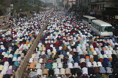 Muslim devotees are observing Jummah prayers along the highway during the Biswa Ijtema.