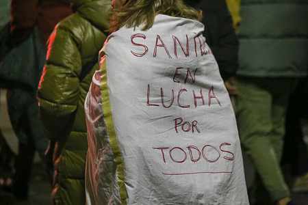 Gijón, Spain, February 6th, 2024: A girl with a cape that says "Healthcare in the fight for all" during the demonstration for quality public healthcare, on February 6, 2024, in Gijón, Spain.