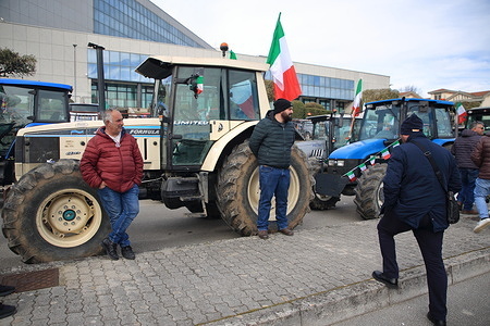 Avellino , Italy - February 07,2024: On the morning of February 04 in Avellino , farmers from various municipalities in the province of Avellino with their tractors went to the headquarters of the Offices of the Campania Region ,to demonstrate their disappointment against the European Community’s agricultural policies. A meeting with local authorities to express their opposition to what Italy and Europe is about to apply as agricultural policies.From 22 January 2024 throughout Italy there are protests from farmers who with their tractors have pushed to make their voice of disappointment heard. Raw materials too expensive, profit margins increasingly reduced, obligations on the management of land to cultivate and obligations to implement an increasingly ecological agriculture.The green deal is much opposed. The agreement provides for the phasing out of fossil fuels and a 43% reduction in global emissions by 2030.