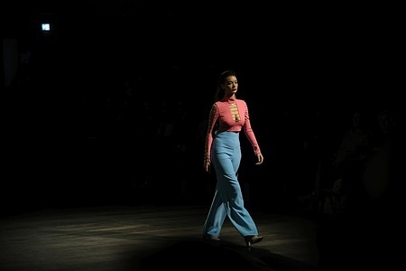 Berlin: The photo shows models with designer Marcel Ostertag's new collection on the catwalk at the Verti Music Hall.