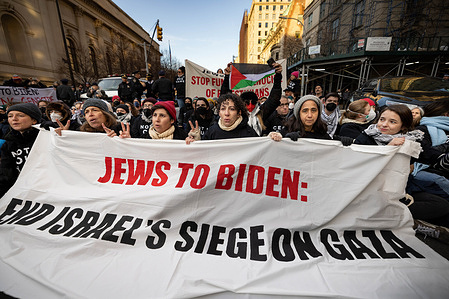 Members of the group Jewish Voice for Peace join activists shutting down traffic in front of the Metropolitan Museum of Art, while protesting President Joe Biden's continued support and funding for Israel in its war against Hamas in Gaza. Biden made several stops in Manhattan for fundraising events but was met by various groups of protesters demanding a cease-fire between Israel and Hamas.