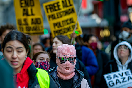 A pro-Palestine protester wears a face cover with the words "Not Nice" sewn onto it during a citywide school walkout calling for a permanent ceasefire at a rally in front of the main branch of the New York City Public Library on February 16, 2024 in New York City. The Ministry of Health in Gaza has said that the death toll has surpassed 30,000 people, around two-thirds of them women and children, since the Israeli-Hamas conflict started on October 7, 2023.