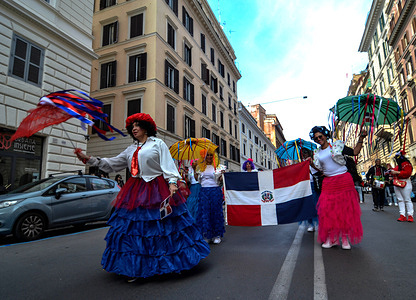 Parade in the center of Rome called by "Dominicans in Italy," with typical and carnivalesque costumes from Santo Domingo, on the occasion of Dominican Independence Day.