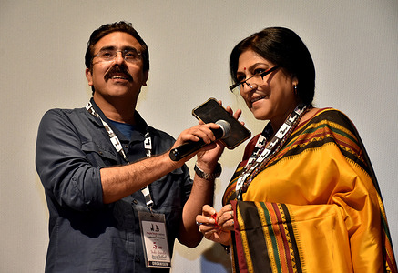 rupa ganguly speaking with gautam ghosh over phone after the screening of padma nadir majhi on the concluding day of the indo bangla movie festival at siri fort auditorium in new delhi