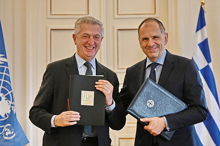 Minister of Foreign Affairs of Greece, George Gerapetritis (right) and UN High Commissioner for Refugees, Filippo Grandi (left) after the signature.