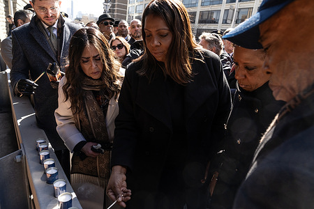 State Attorney General Letitia James lits candles on Ari Halberstam Memorial Ramp in New York on March 1, 2024 on 30th anniversary commemoration of the death of Ari Halberstam. Ari Halberstam was killed and 3 more Jewish students were wounded by a terrorist on a ramp leading to Brooklyn Bridge, later named after him as Ari Halberstam Memorial Ramp on March 1, 1994. Memorial service was organized and attended by mayor Eric Adams, and joined by State Attorney General Letitia James, City Council Speaker Adrienne Adams, Brooklyn District Attorney Erc Gonzalez, Police Commissioner Edward Caban, Chief of Transit Michael Kemper, mother of Ari Devorah Halberstam, his brother Shea Halberstam, elected officials, police officers and members of Chabad-Lubavitch community.