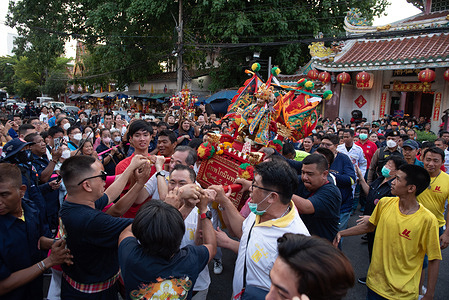 Believers parade a statue replica of Najasa Tai Zhi god, a deity and sacred object that people respect In front of Poh Teck Tung Foundation in Bangkok on March 10, 2024.