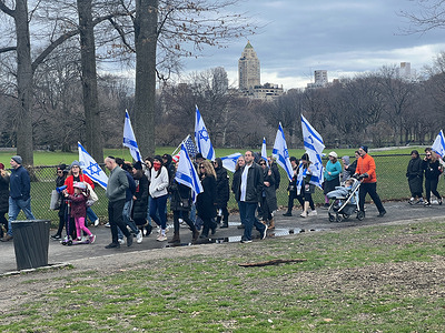 Hundreds of Israeli supporters marched through Central Park holding Israeli flags in New York City to stand in solidarity with Israel and its people.