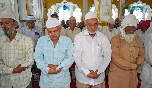 Indian muslims attend an mid-day prayer called 'Zohar namaz' at Jama Mosque on the first day of the Islamic holy fasting month of Ramadan in Beawar.