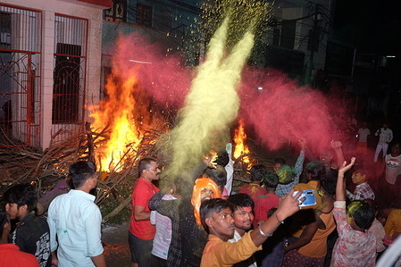 People from Hindu community fire the "Holika" on Sunday night to celebrate Holi festival in district Prayagraj, Uttar Pradesh. Hiranyakashipu's sister, Holika, had a boon granting her immunity to fire. She attempted to trick Prahlad into a pyre, but divine intervention led to her demise while Prahlad emerged unscathed. This event symbolizes the victory of good over evil, a theme central to Holika Dahan.