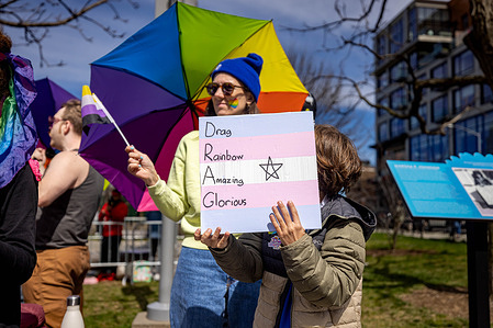 Drag Queen story hour supporters protect the outdoor event against far-right activists at the Marsha P. Johnson State Park on March 30, 2024 in Brooklyn, New York. The group put on a Drag Queen story hour as a family-friendly event leading up to The International Transgender Day of Visibility, an annual day of recognition celebrated around the world on March 31st.