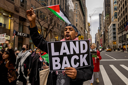 Pro-Palestinian demonstrators march during a rally on the 48th anniversary of Palestinian Land Day on March 30, 2023 in New York City. Every year on March 30, Palestinians observe Land Day, or Yom al-Ard, recalling the events of March 30, 1976, when six unarmed Palestinians were killed and more than 100 injured by Israeli forces during protests against Israel's confiscation of Palestinian land.