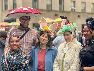 People wearing flowery hats and costumes participate in the annual Easter Parade and Bonnet Festival along Fifth Avenue on Easter Sunday in New York City.