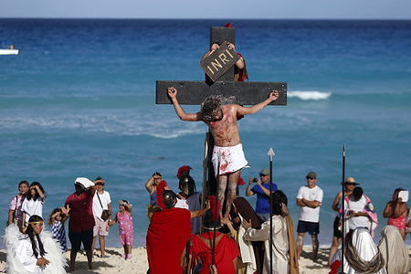 CANCUN, MEXICO - MARCH 29: Dozens of actors and volunteers are seen on Friday, March 29, 2024, while participating in the 13th edition of the 'Passion of Christ' performance that marks the Good Friday festivities, in the Delfines beach, in Cancun, Quintana Roo (Mexico). One of the most special days of the Catholic calendar during Holy Week is Good Friday, on which it is believed that Christ was crucified. Different representations of this act are held around the world, but none like the one represented in Cancun in which the Way of the Cross takes place on the shore of the Caribbean sea. In Mexico, the most popular is Iztapalapa, which was held for the first time in 1843. According to official figures, almost five thousand people, mainly from Cancun, as well as national and foreign tourists, gathered at the popular Delfines beach to participate in he representation. Last year, after having resumed the performance after a three-year hiatus due to the pandemic caused by COVID-19, the people of Cancun were invited to join the cast, which had an effect, since on this occasion the performance was resumed complete, reaching a duration of just over an hour. In addition to this representation on the beach, throughout Cancun there were around 22 other religious congregations that had some commemoration of this type for Holy Week. (Photo by Hugo Ortuño)
--
CANCÚN, MÉXICO - MARZO 29: Decenas de actores y voluntarios son vistos, hoy, viernes 29 de marzo de 2024, mientras participan en la XIII edición de la representación de la 'Pasión de Cristo' que marca las festividades del Viernes Santo, en la playa Delfines, en Cancún, en Quintana Roo (México). Uno de los días más especiales del calendario católico durante la Semana Santa, es el Viernes Santo, en el que se cree que Cristo fue crucificado. Aalrededor del mundo se realizan diferentes representaciones de este acto, pero ninguna como la que se escenifica en Cancún, en la que el Viacrucis se lleva a cabo a la orilla