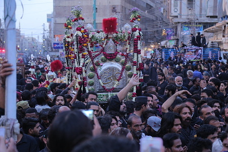 Thousand of Shiite Muslims take part in the procession to commemorate the martyrdom of Imam Ali, the cousin and son-in-law of Prophet Mohammed during the holy month of Ramadan.