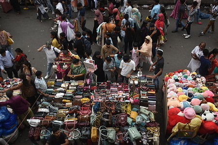 People are shopping inside a market ahead of the Eid al-Fitr festival in Kolkata.